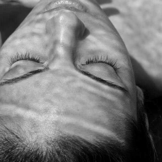 bandw sun damage cover woman in sun